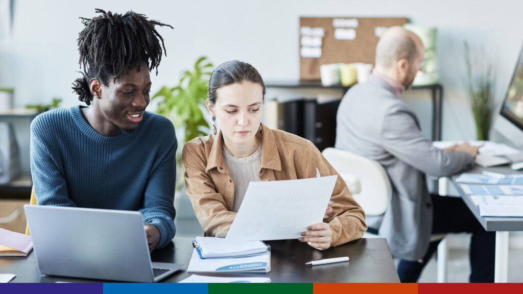 Students helping each other with an application