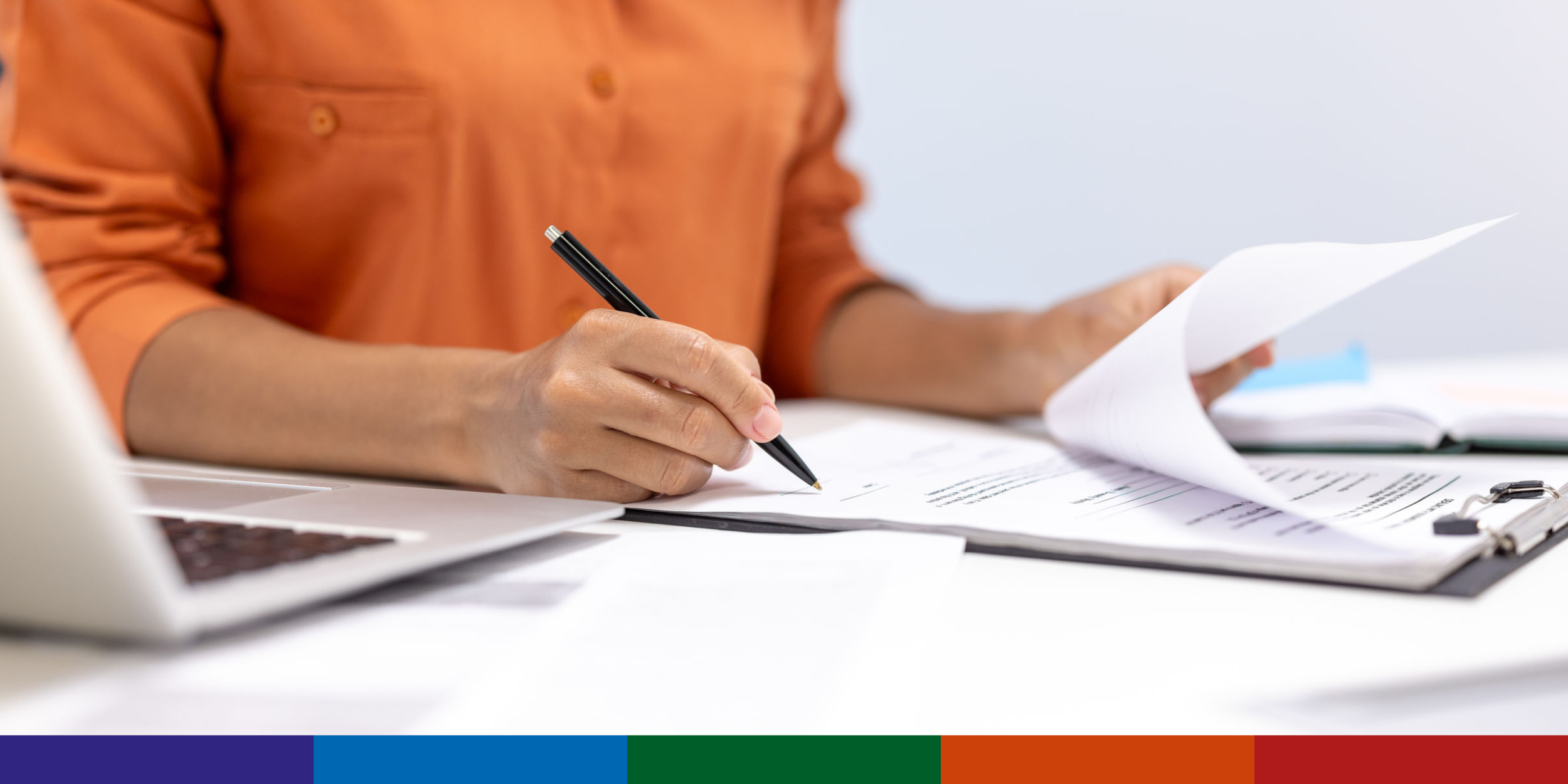Image of woman marking up a document
