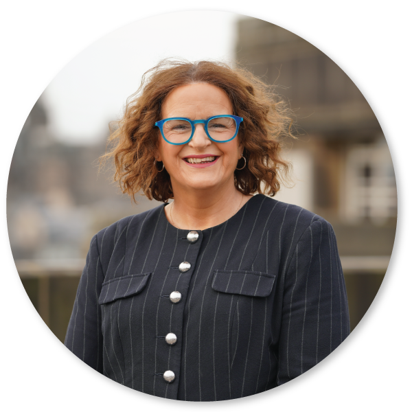 Portrait of our Director General for Communities, Miriam Craven, smiling. 
